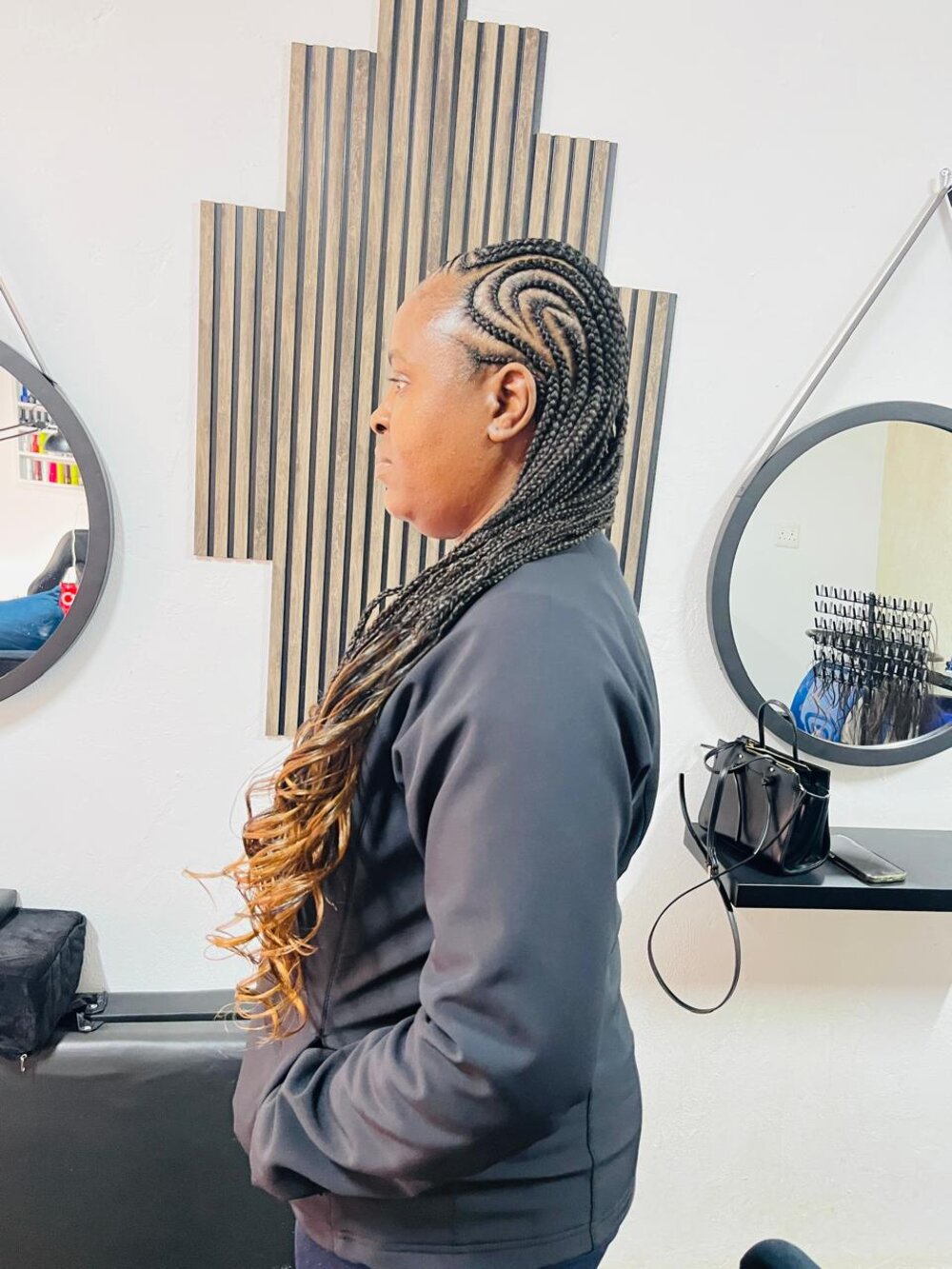 Braided hairstyle by Rue's Beauty Studio