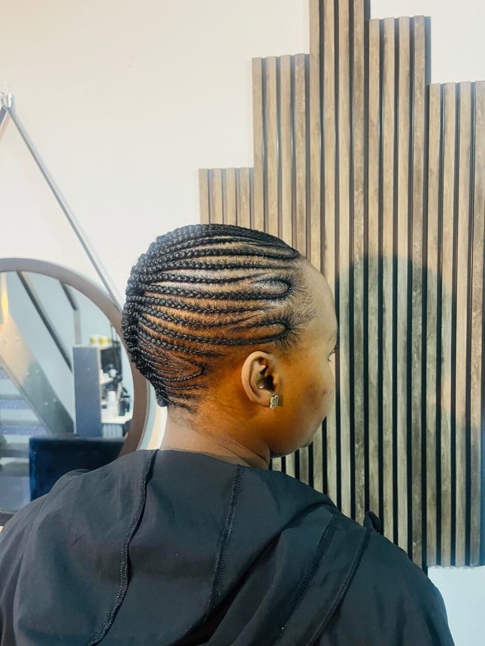 Braided hairstyle by Rue's Beauty Studio