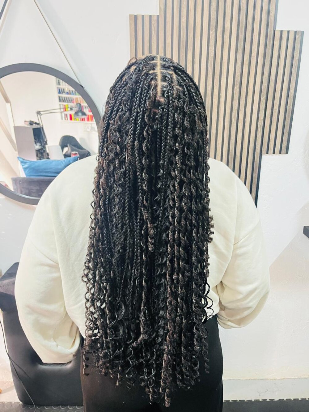 Braided hairstyle by Rue's Beauty Studio
