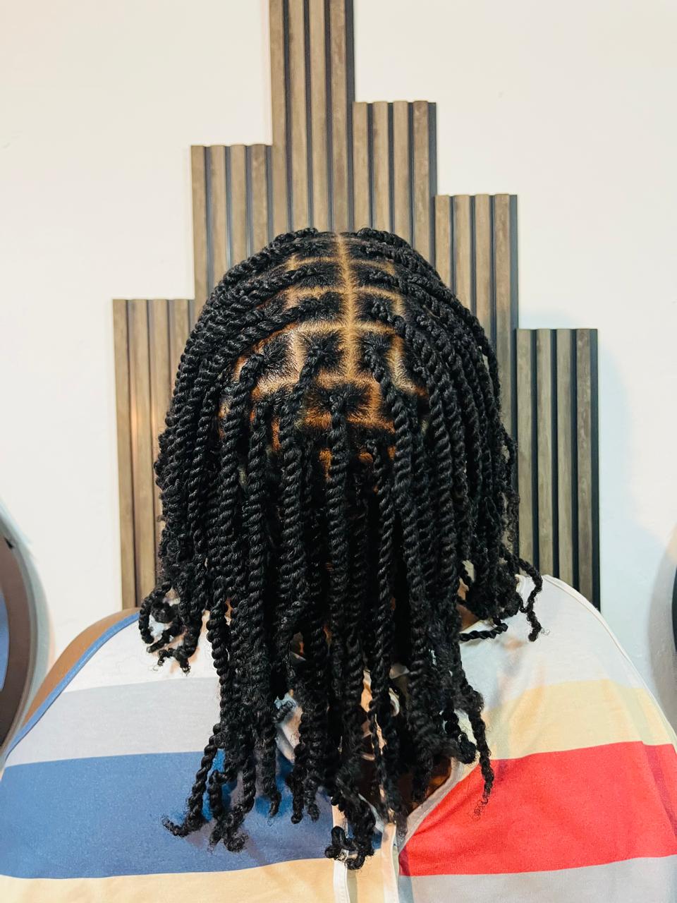 Two-strand twists with neat square parting by Rue's Beauty Studio